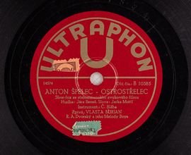 Anton Špelec – Ostrostřelec, Ultraphon [1932], gramofonová deska z šelaku o průměru 25 cm (z podsbírky NM – ČMH, fond fonotéky, inv. č. MF 4514)